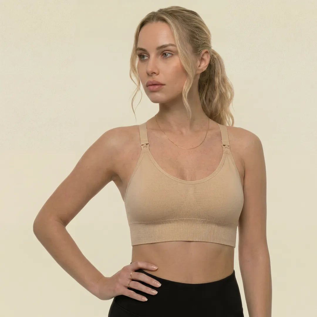 Nude active nursing bra smooth cup with drop-clip strap nursing access, upper body studio portrait shot