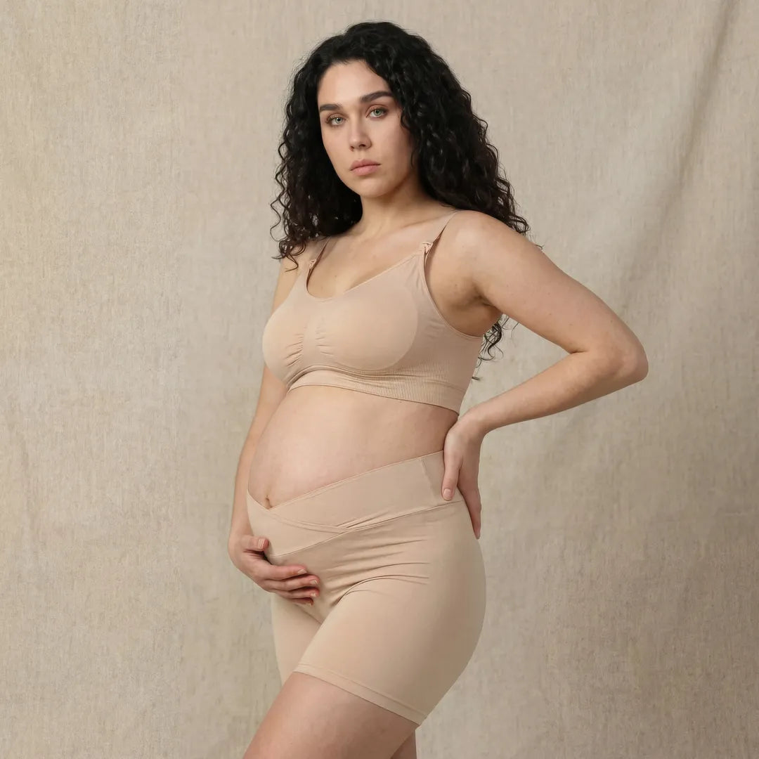 Nude maternity bump support short crossover waistband, pregnant model side view