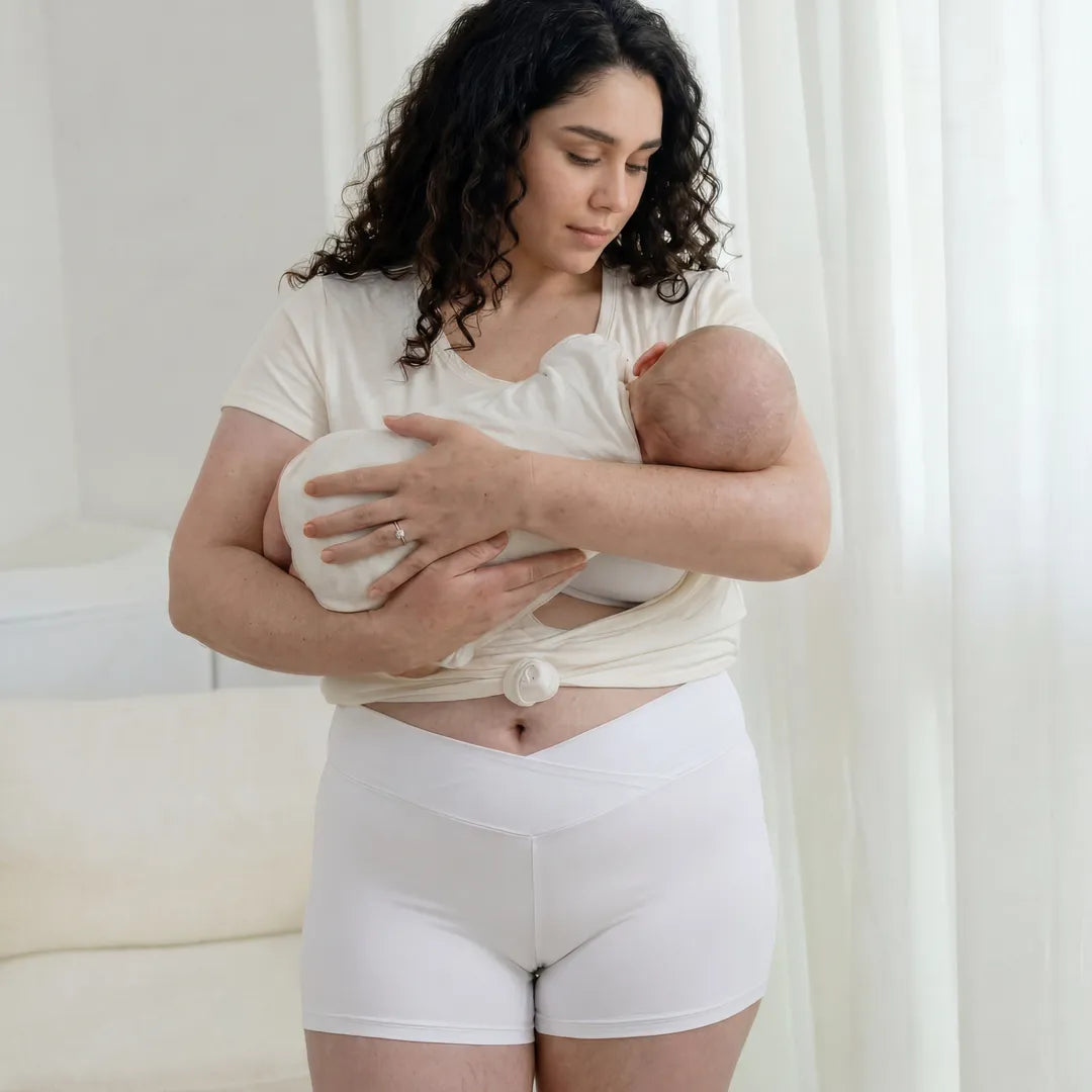 White maternity bump support short crossover waistband, postpartum lifestyle with baby