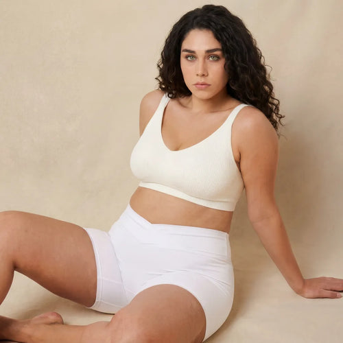 White maternity bump support short crossover waistband, seated lifestyle view