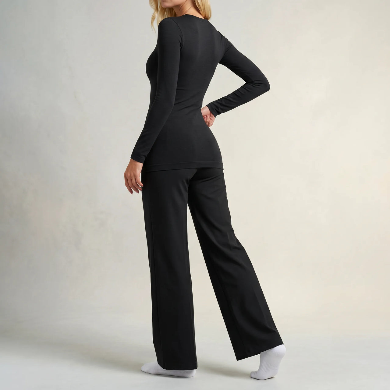 Black Calma high-waisted straight-leg trouser, back view showing high foldover waistband