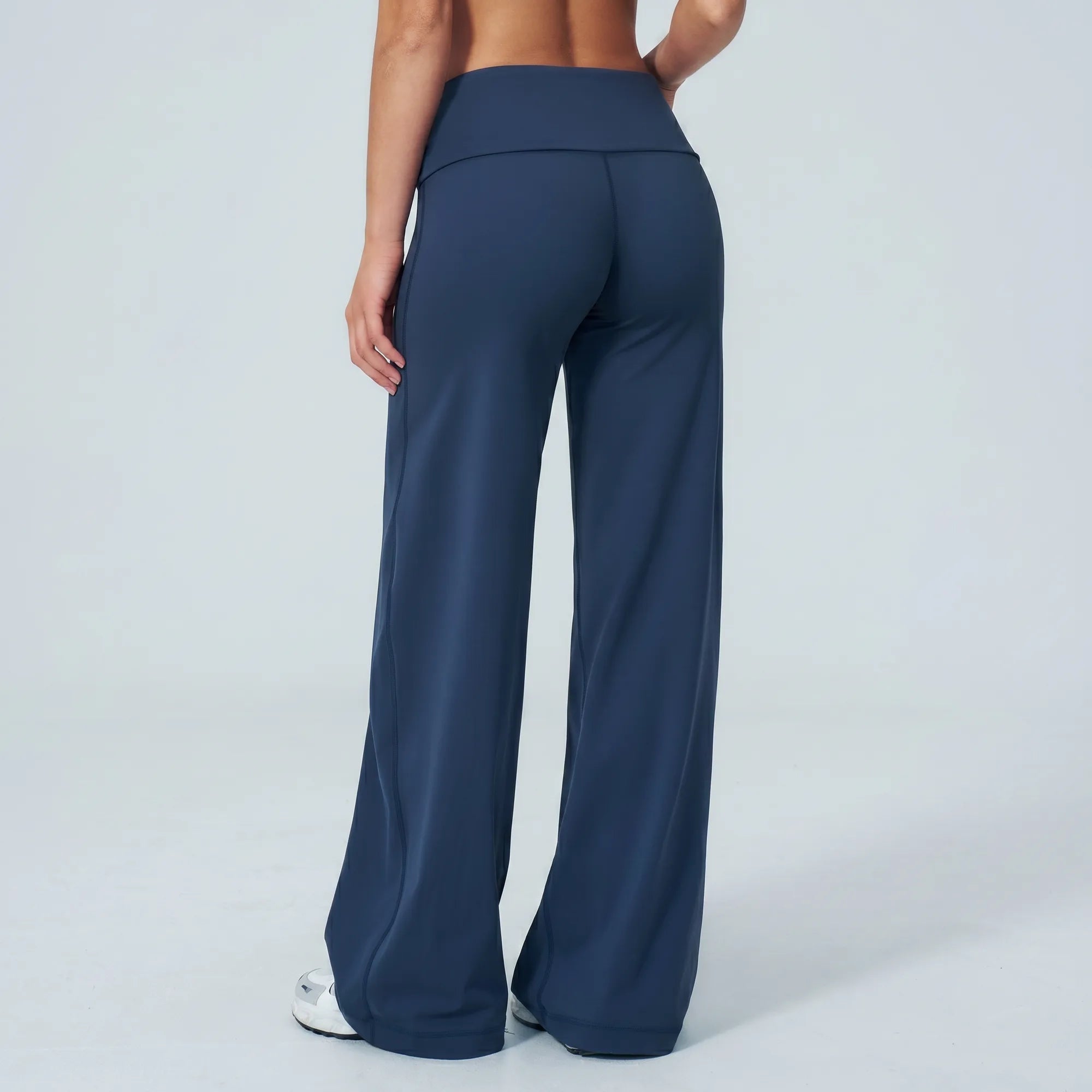 Navy Calma high-waisted straight-leg trouser, back view showing high foldover waistband