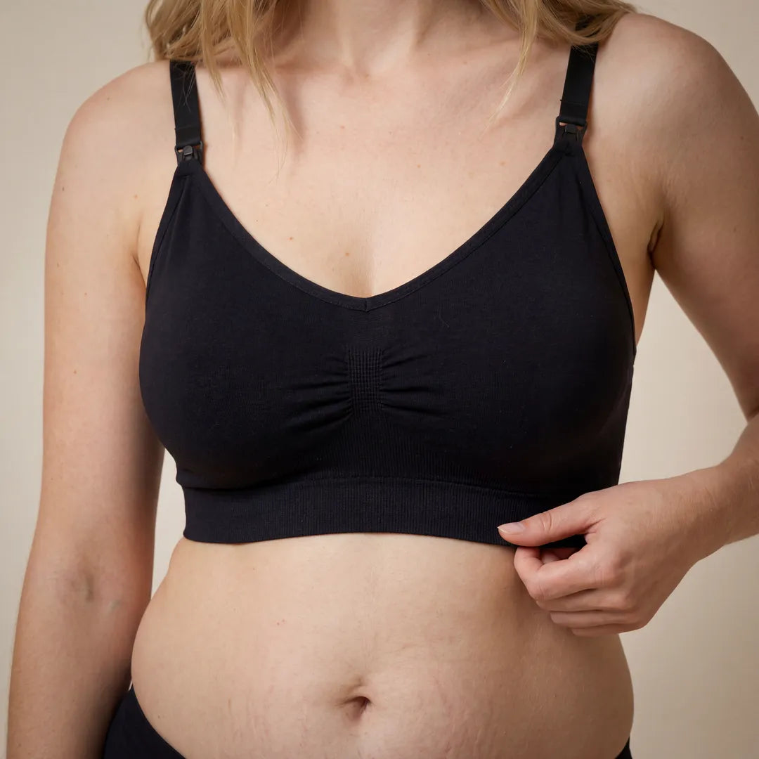 Black classic nursing bra smooth gathered cup with drop-clip strap access, close-up upper body detail shot