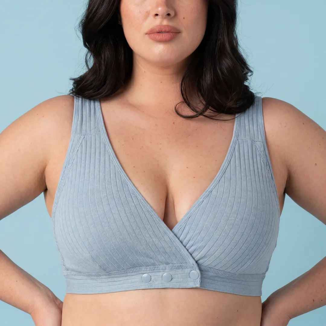 Light blue nursing cotton bra ribbed crossover wrap front with snap buttons, close-up upper body detail shot