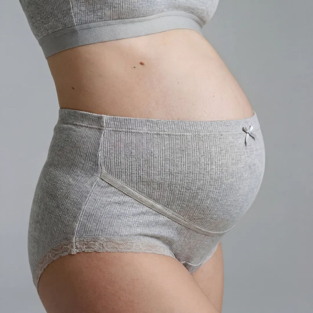 Grey maternity cotton brief lace trim belly support, pregnant model side close view