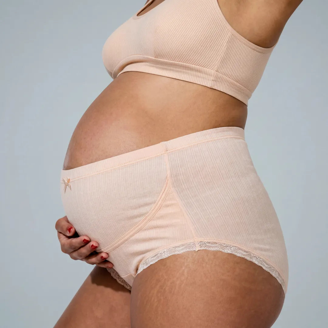 Nude maternity cotton brief lace trim belly support, pregnant model side view