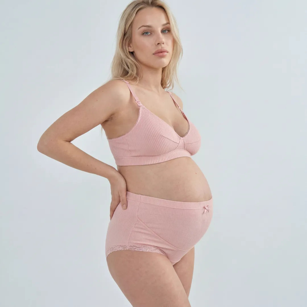 Pink maternity cotton brief lace trim belly support, pregnant model front view