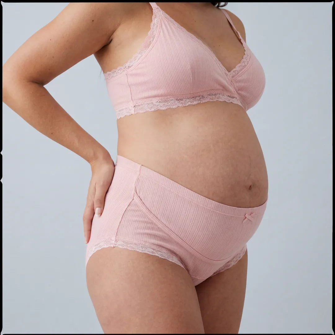 Pink maternity cotton brief lace trim belly support, pregnant model side view