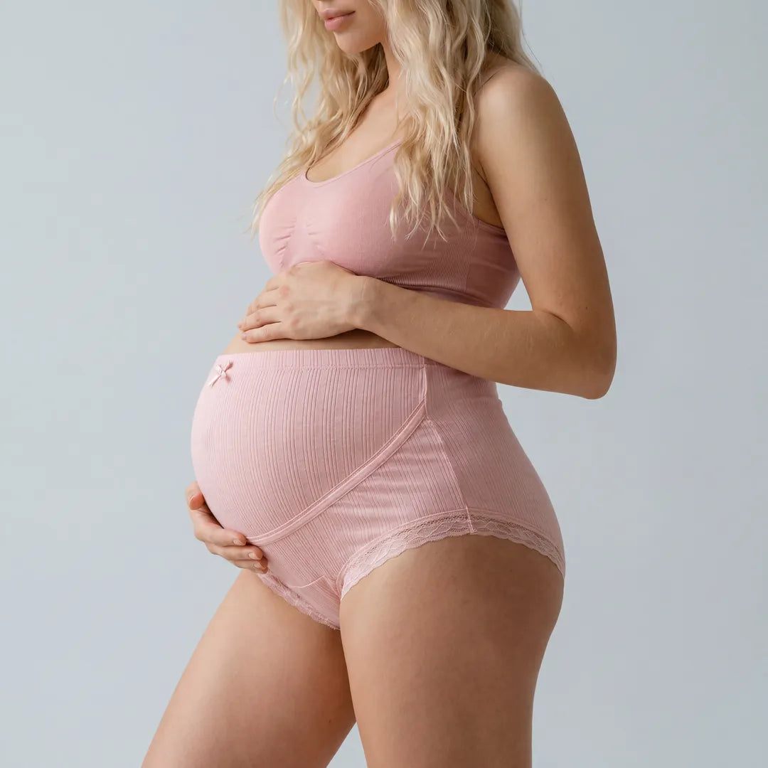 Pink maternity cotton brief lace trim belly support, pregnant model side view