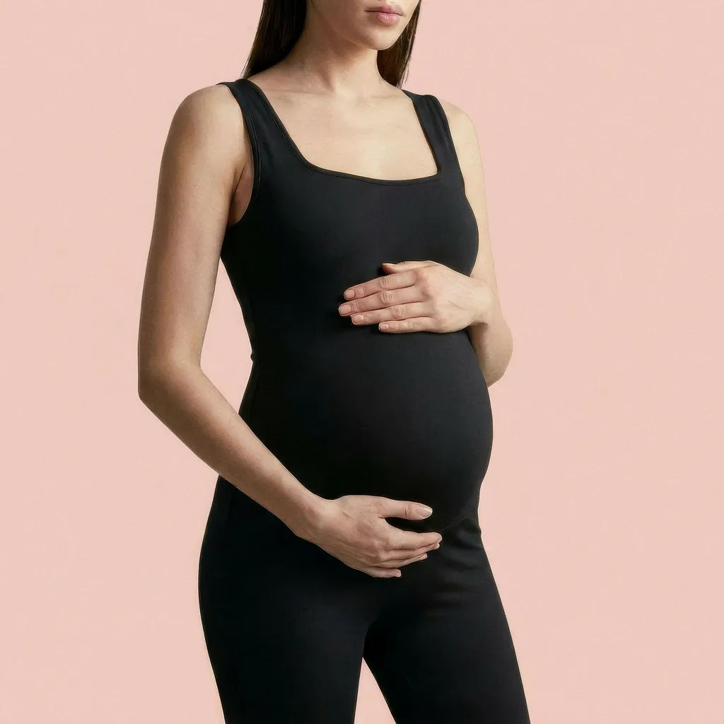 Black maternity daily jumpsuit square neckline bump-hugging stretch, neckline bump detail crop