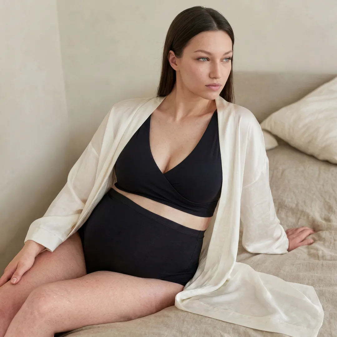 Black nursing bra crossover wrap front, seated lifestyle view