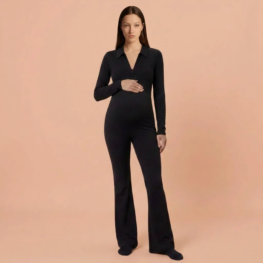 Black maternity flare jumpsuit polo collar zip bump fit, full length front studio view