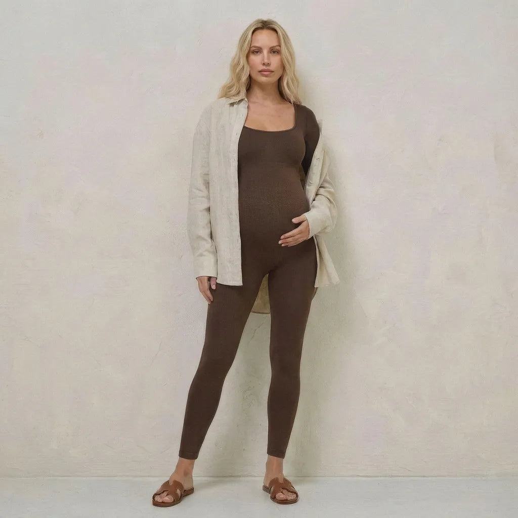 Chocolate maternity jumpsuit bump-hugging stretch fit, styled lifestyle with layered shirt