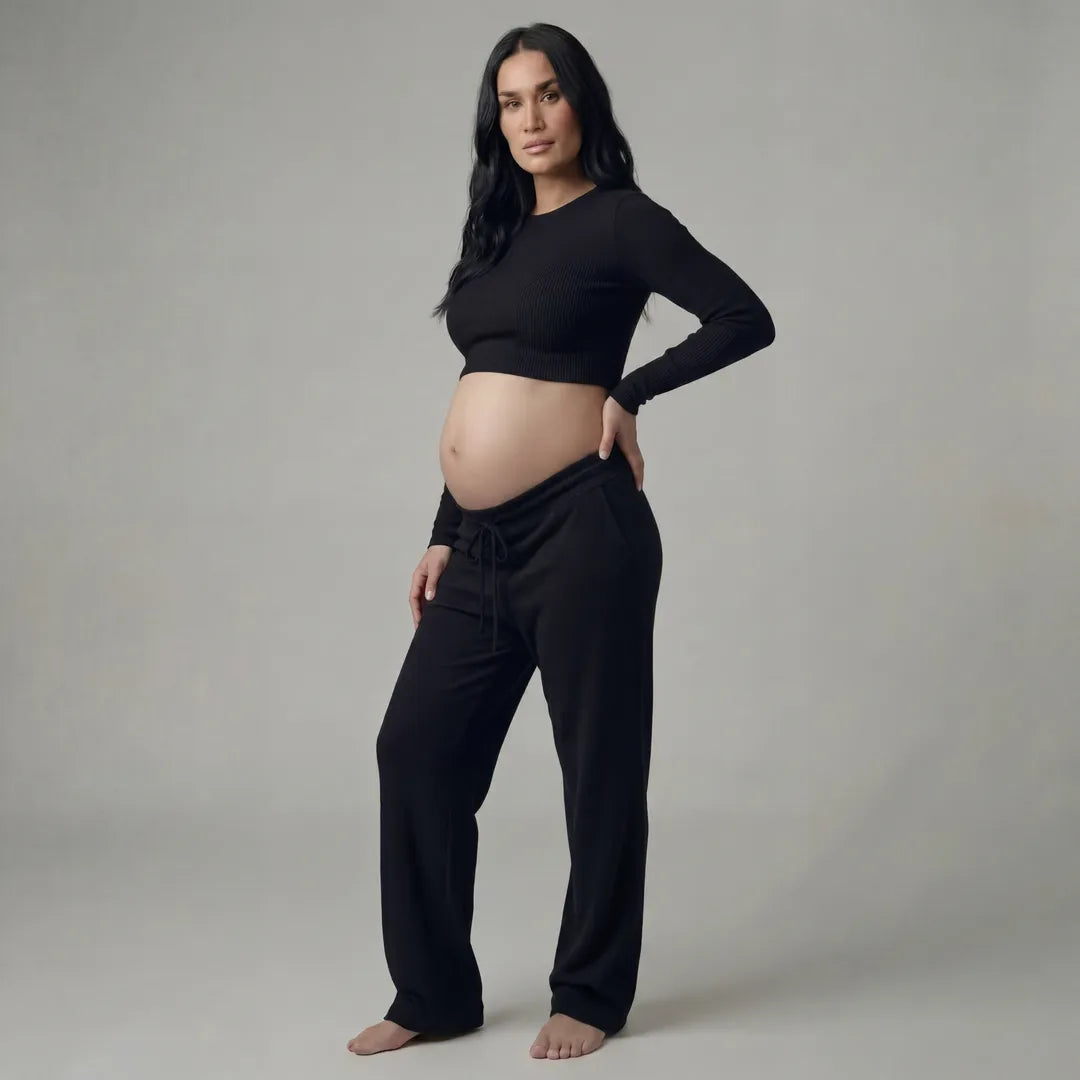 Black knit maternity trousers with drawstring waist, full length front view
