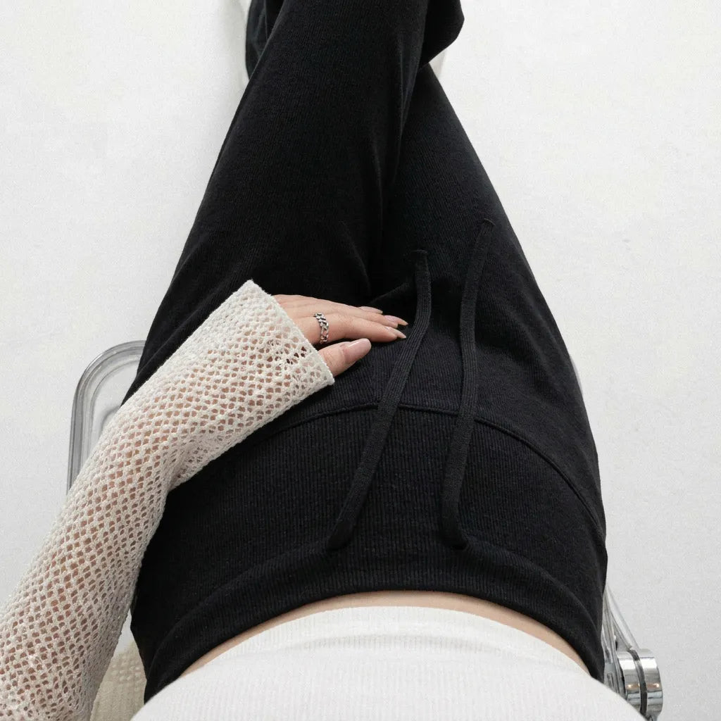 Black knit maternity trousers drawstring waist overhead detail shot