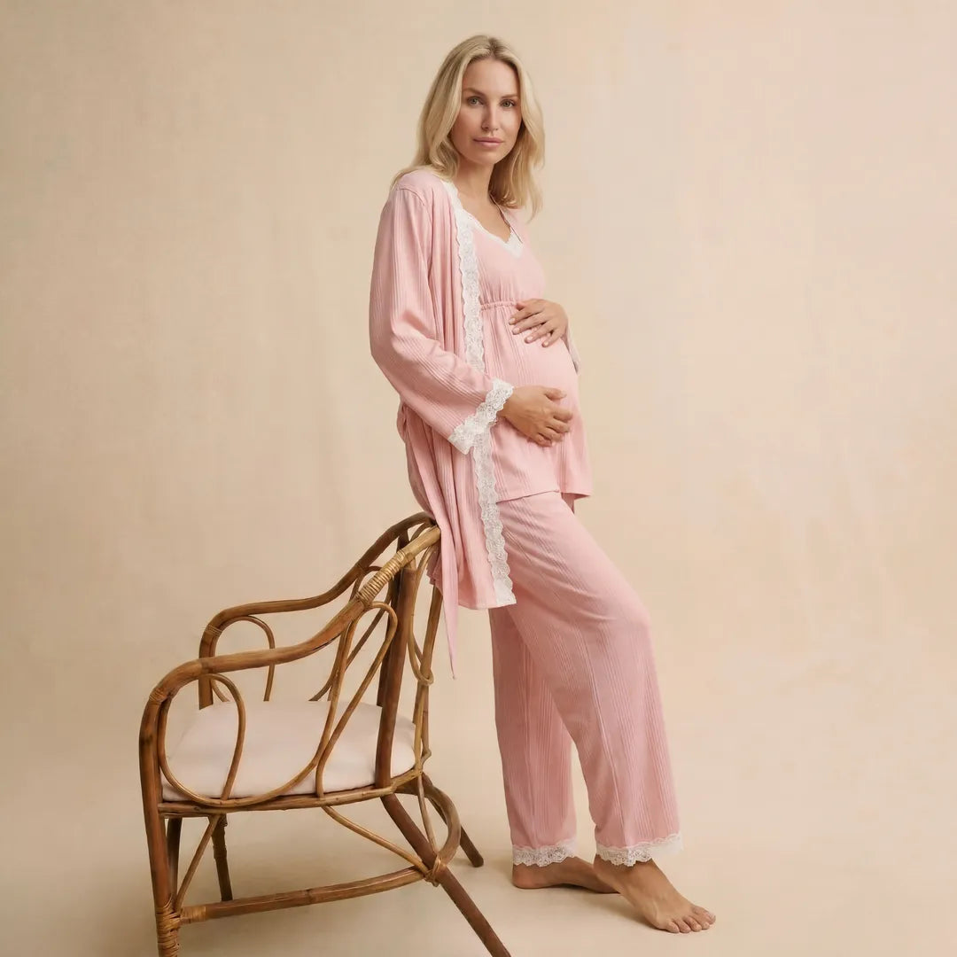 Pink maternity cotton lounge set lace trim robe and trousers, seated editorial with rattan chair