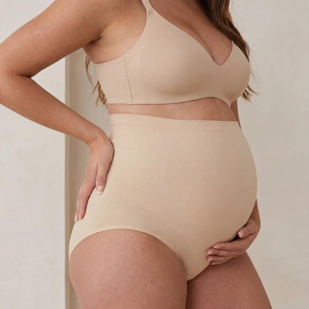Nude maternity seamless brief high-rise belly support, pregnant model side close view