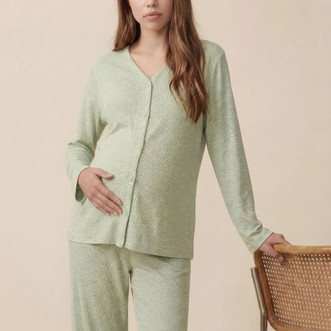 Sage maternity modal nursing set button-front nursing top, half body bump close-up studio shot