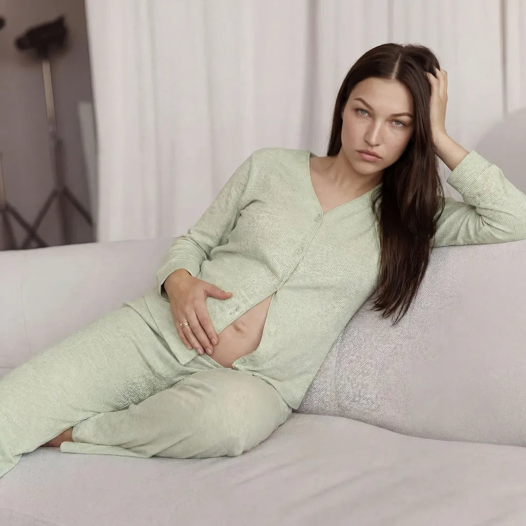 Sage maternity modal nursing set ribbed button-front nursing top, lifestyle reclining sofa shot