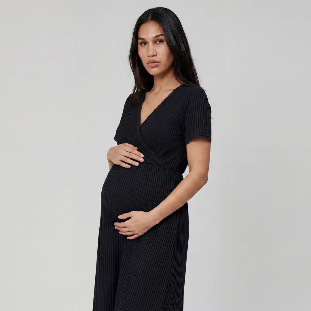 Black maternity night nursing dress ribbed wrap front with lace trim, three quarter angled maternity bump shot
