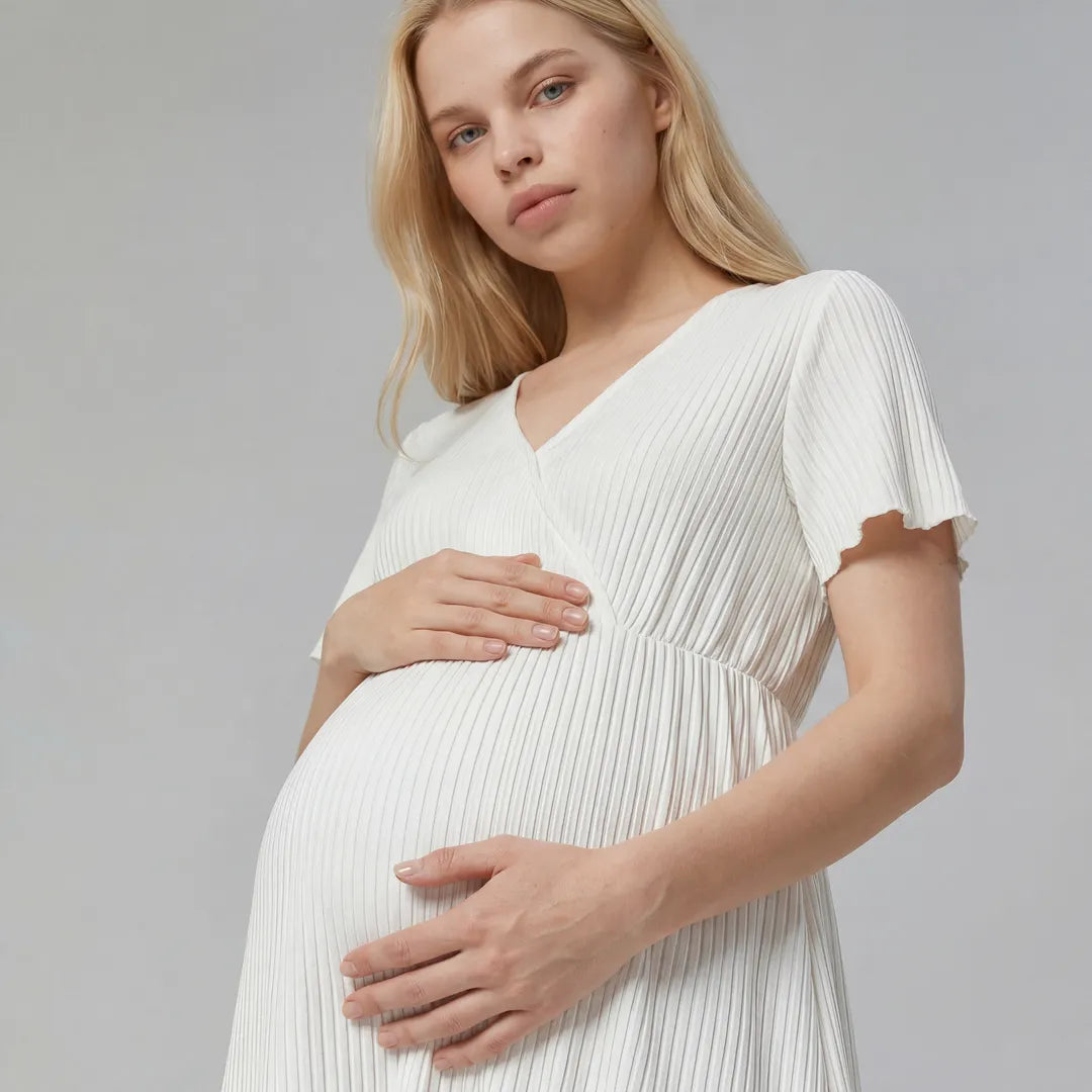 White maternity night nursing dress ribbed wrap front flutter sleeves, close up maternity bump detail shot