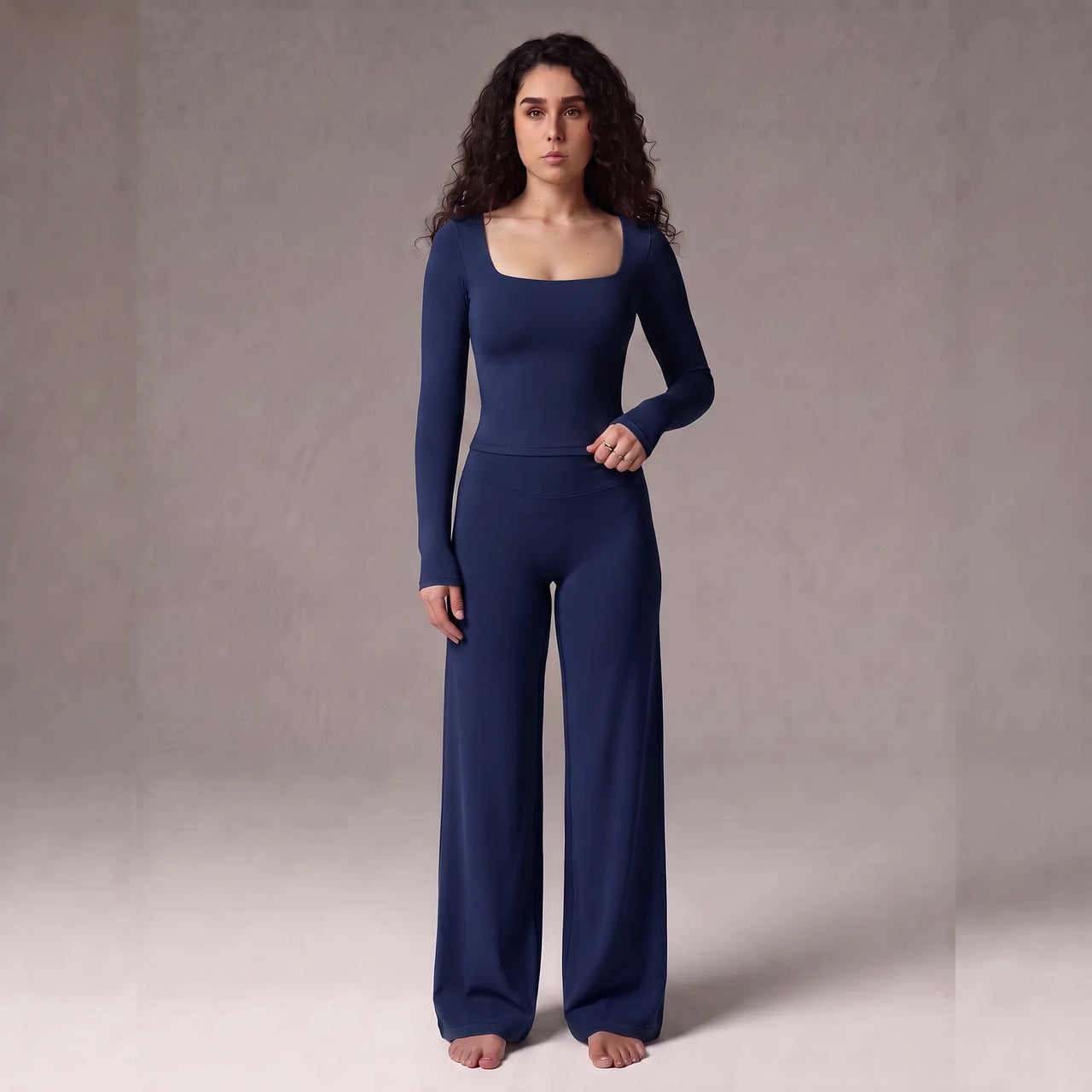 Woman wearing navy Pulso high-waisted wide-leg postpartum trouser