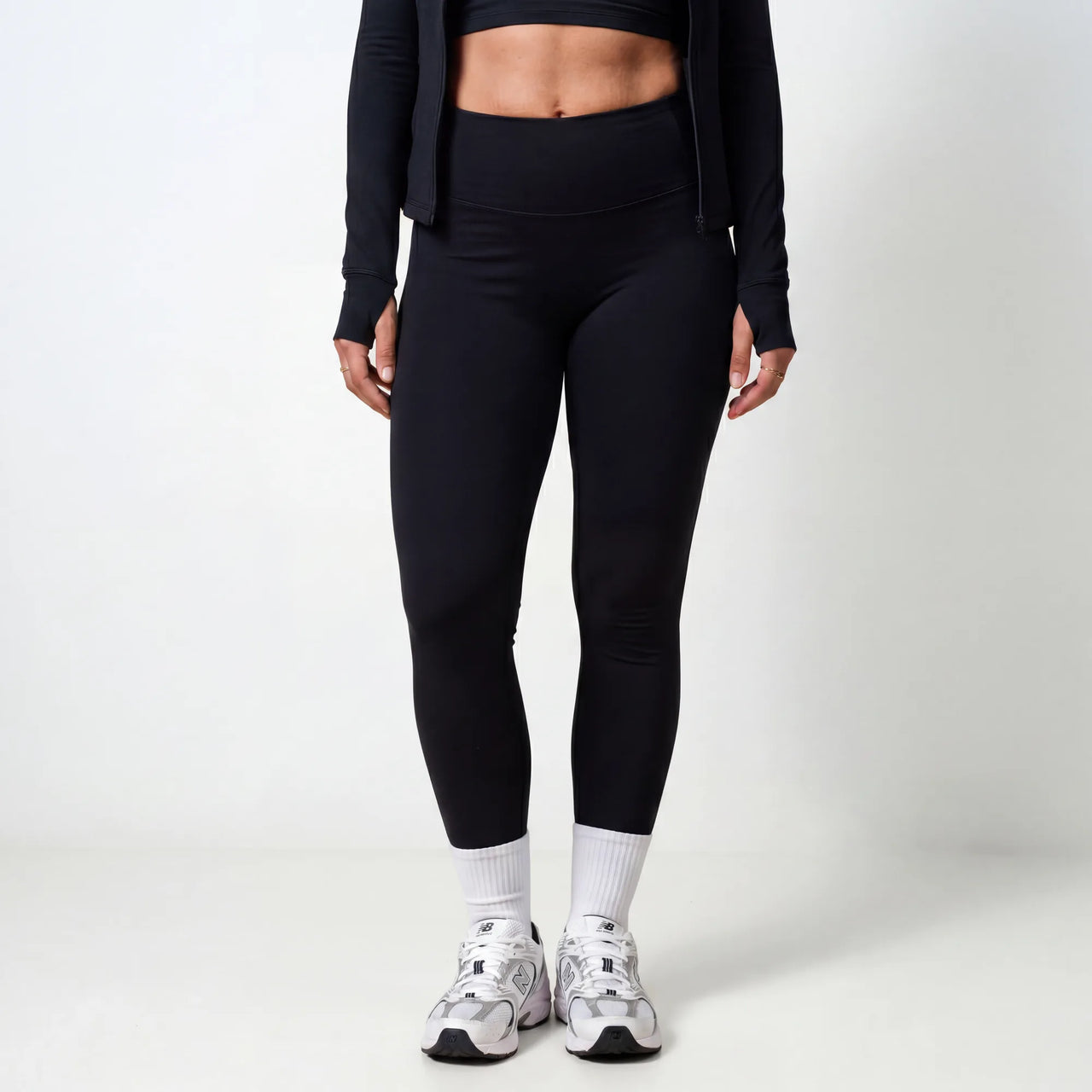Black Retorno high-waisted postpartum legging, high waistband front detail