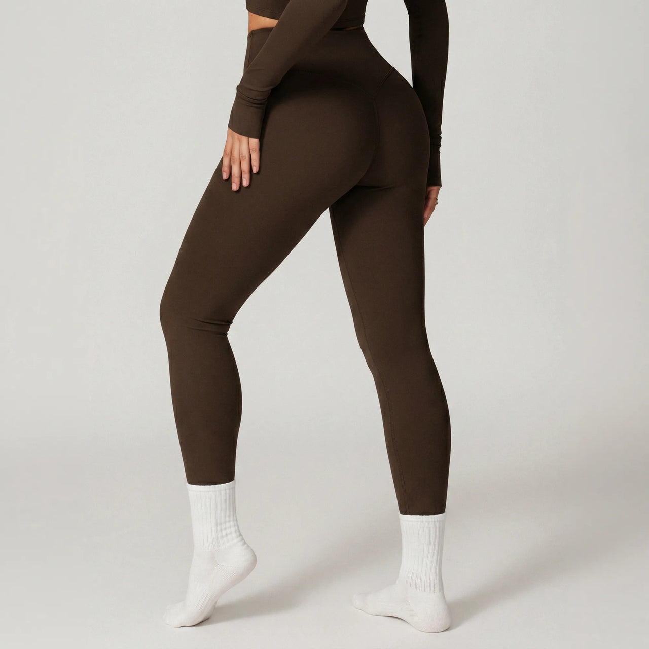 Chocolate brown Retorno high-waisted postpartum legging, side view