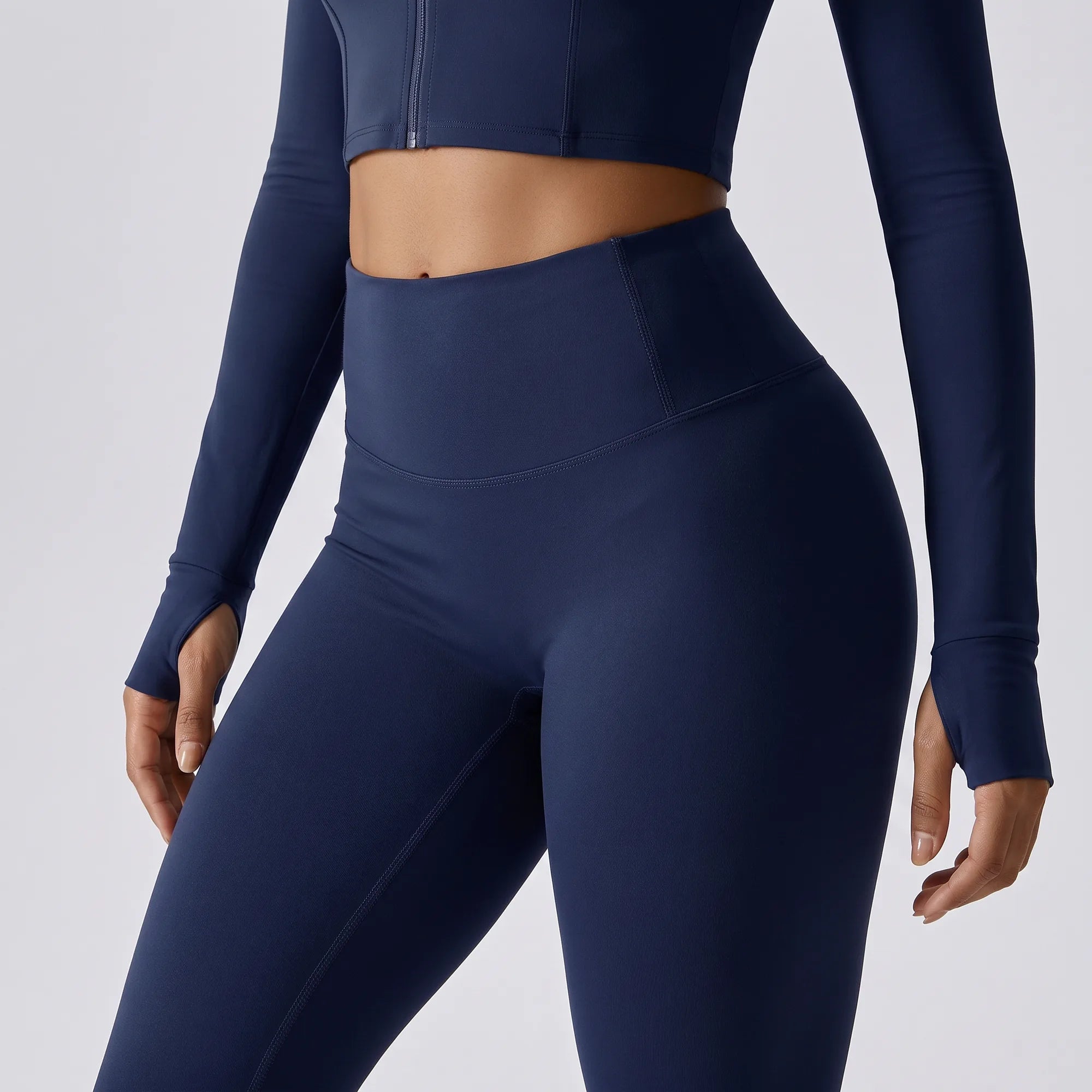 Navy Retorno high-waisted postpartum legging, high waistband side detail