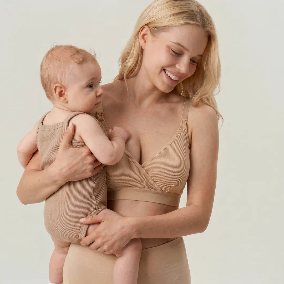 Nude seamless nursing bra crossover wrap cup with clip nursing access, lifestyle smiling postpartum holding baby shot