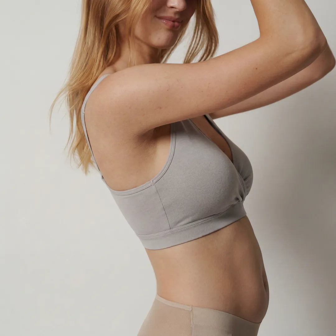 Grey sleep nursing bra crossover wrap front racerback straps, angled side profile shot