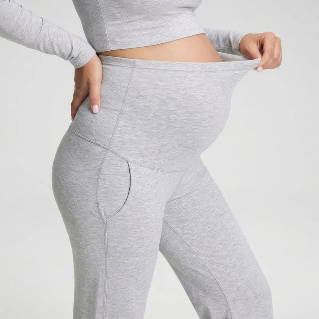 Gray wide maternity trousers over-bump waist panel, side close-up